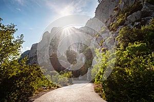 Asphalted road in the mountains, beautiful sunshine, summer vacation time