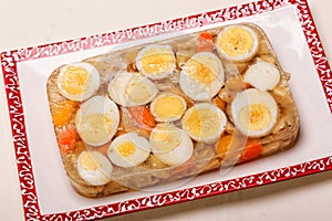 Aspic of Boiled Eggs and Chicken on Plate photo