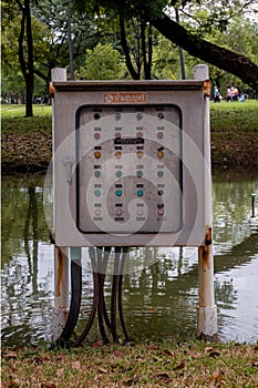 Aspirating aerator control unit next to a pond in Lumpini park, Bangkok, Thailand. photo