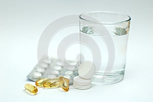 Aspirin/paracetamol and a glass of water