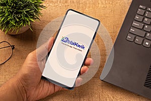 Assam, india - April 10, 2021 : MobiKwik logo on phone screen stock image.