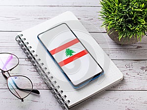 Assam, india - Augest 8, 2020 : Flag of Lebanon on phone screen.