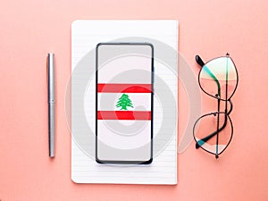 Assam, india - Augest 8, 2020 : Flag of Lebanon on phone screen.