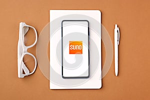 Assam, india - March 10, 2021 : Audible Suno logo on phone screen stock image.