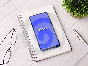 Assam, india - March 10, 2021 : Coinbase logo on phone screen stock image.