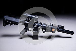 Assault rifle with silencer and optical scope