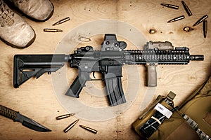 Assault rifle on a wooden table