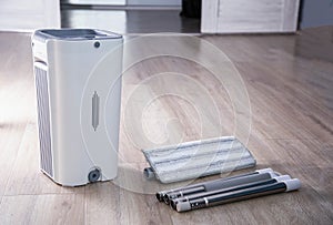 Assembling a bucket with a modern mop with a wringer for easy cleaning. Copy space for text, rinsing the mop