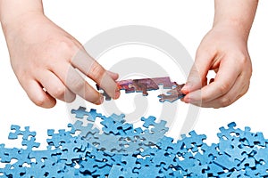 Assembling of jigsaw puzzles isolated