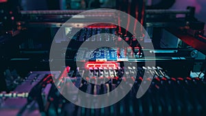 Assembling of system board components by robotic hand.