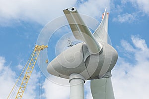 Assembling wings Dutch windturbine with large crane