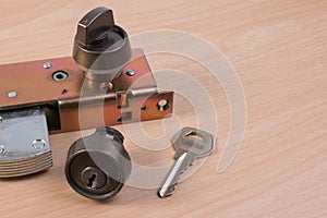 Assembly of aluminium door lock for installation, adjustment or repair.