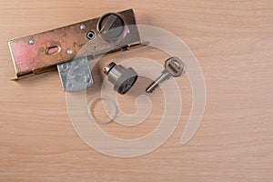 Assembly of aluminium door lock for installation, adjustment or repair.