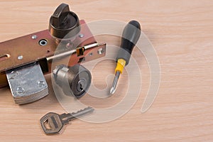 Assembly of aluminium door lock for installation, adjustment or repair.