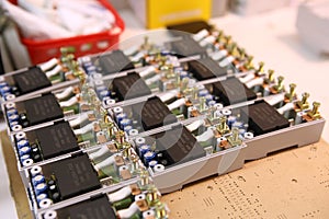 Assembly of electronic components for voltage relays. Manual assembly of electronic components for home electrical