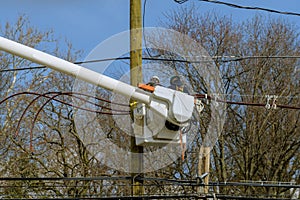 assembly and installation of new support and wires of a power line electricians repairing wire on electric power pole