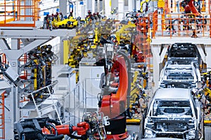 Automotive production line. Welding car body. Modern car Assembly plant