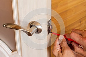 Assembly of lock with handles and latch for an interior door