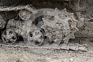 The assembly of the mechanism of the undercarriage of a crawler tractor in disassembled form. in view of maintenance.