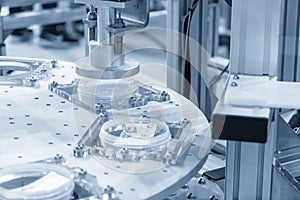 The assembly process by robotic system in the light blue scene