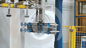 Assembly washing machine on robotic equipment at industrial factory