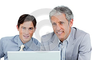 Assertive business partners working at a computer