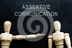 Assertive communication phrase and two figures