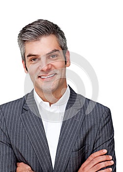 Assertive mature businessman with folded arms