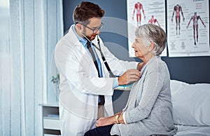 Assessing to ensure all is in check. a doctor examining a senior patient with a stethoscope in a clinic.