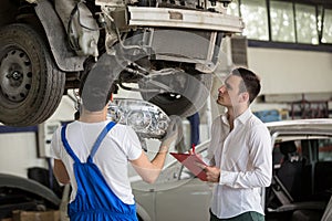 Assessor analyzing damage crash car