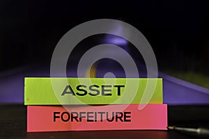 Asset Forfeiture on the sticky notes with bokeh background