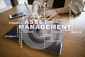 Asset management on the virtual screen. Business concept. Words cloud.