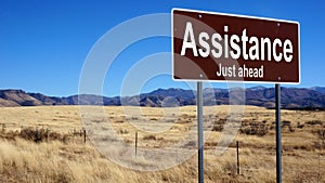 Assistance brown road sign