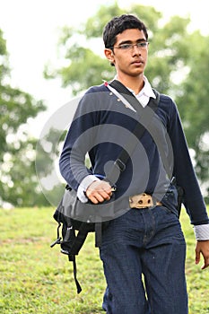 Assistant Camera man with camera bag walking