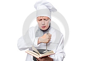 Assistant cook wants to be a chef reading a recipe book