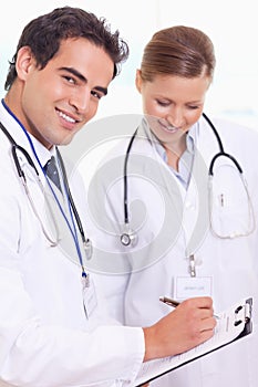 Assistant doctors with patient record