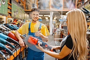 Assistant and female purchaser in hardware store