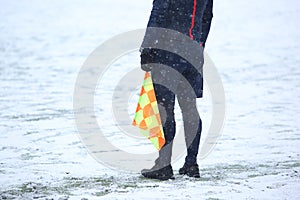 Assistant of referee with flag
