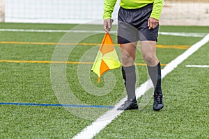 Assistant referee hold flag. closeup
