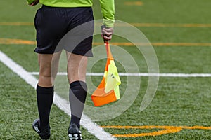 Assistant referee hold flag. closeup