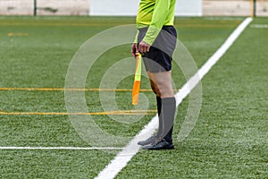 Assistant referee hold flag. closeup