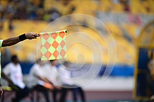 Assistant referee hold flag,offside signal