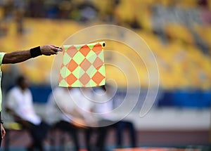 Assistant referee hold flag,offside signal