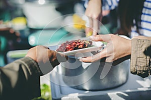 Assisting people with homeless food: Charity: People come to receive free food from volunteers