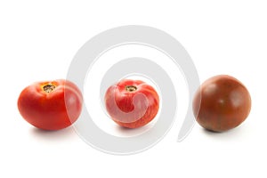 Assort of different color tomatoes isolated on white background with clipping path