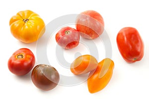 Assort of different shape and color tomatoes isolated on white background with clipping path