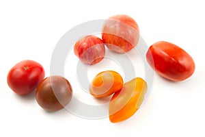 Assort of different shape and color tomatoes isolated on white background with clipping path