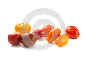 Assort of different shape and color tomatoes isolated on white background with clipping path