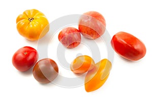 Assort of different shape and color tomatoes isolated on white background with clipping path