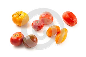 Assort of different shape and color tomatoes isolated on white background with clipping path